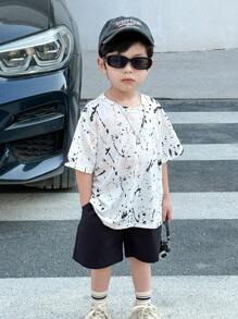SHEIN 2 Pcs/Set Young Boys Leisure Street Inkjet Graffiti White T-Shirt And Black Loose Shorts Two-Piece Set Suitable For Spring And Summer Seasons, Suitable For Daily Life, Suitable For Sports, Suitable For Campus, Suitable For Gatherings, Suitable For Festivals, Suitable For Performances, Suitable For Photography, Suitable For Returning To School Season
