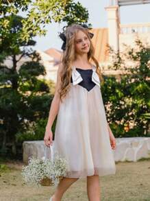 SHEIN Vestido elegante, hermoso y adorable para niña preadolescente, sin tirantes, con manga de malla abullonada y lazo, en negro y blanco, apropiado para verano y primavera, ideal para fiestas y vacaciones - Blanco y Negro - Ver 4