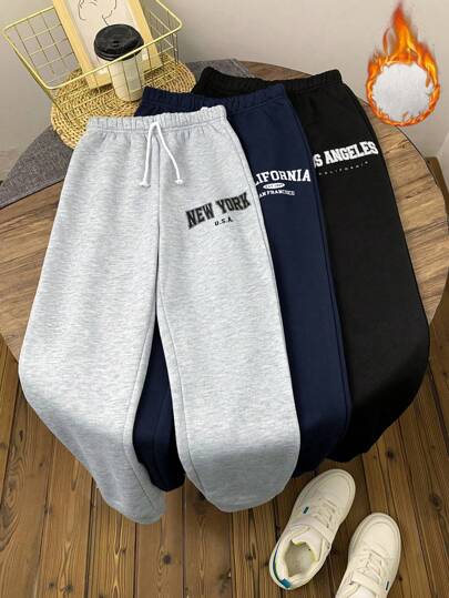 SHEIN Essnce بنطلون رياضي سهل مطبوع عليه حرف للسيدات مع جيب وربطة أمامية