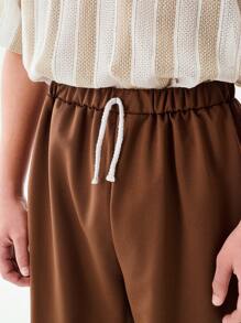 SHEIN 1pc Teen Boys Solid Brown Simple Casual Loose Shorts, With Brand "UNPL" Print On Left Leg, Drawstring Waist Design, Relaxed Fit Suitable For Sports Shoes And Outdoor Activities, Sporty & Casual Occasions - Brown - View 3