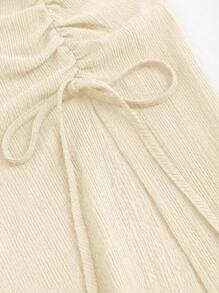 Sweetra Bộ 2 món: Áo crop top buộc cổ bất đối xứng và chân váy xếp ly xẻ tà - Màu be - Xem 4