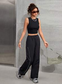 SHEIN Set due pezzi stile strada, pantaloni larghi con tasche laterali e coulisse in colore nero e canotta di colore unito senza maniche, adatto per ragazze adolescenti