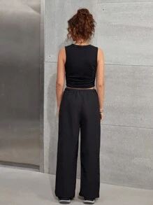 SHEIN Set due pezzi stile strada, pantaloni larghi con tasche laterali e coulisse in colore nero e canotta di colore unito senza maniche, adatto per ragazze adolescenti