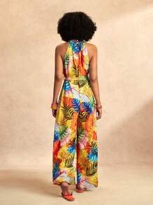 Slaydiva Combinaison pour femmes avec imprimé feuilles oranges colorées, col montant, bretelles halter, sans manches, jambes larges extra-longues, section de taille avec nœud papillon. Pour les vacances à la plage, nouveau printemps et été.