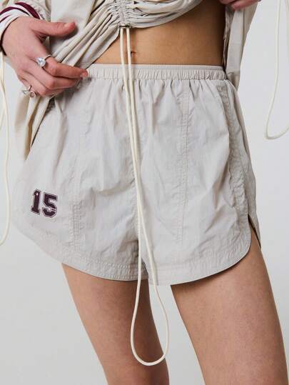 SHEIN Unity Summer Number Print Panelling Dolphin Hem Nylon Sports Shorts