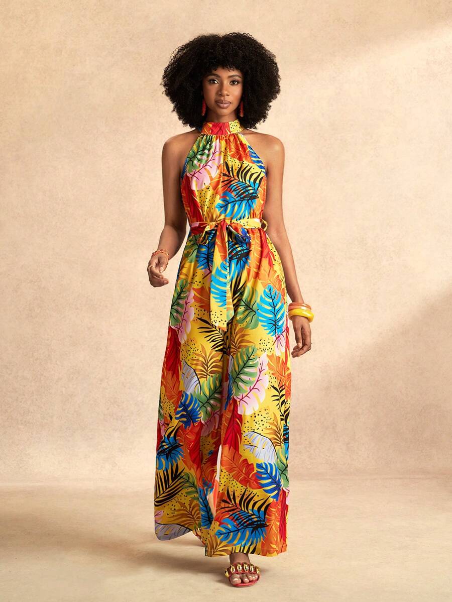 Slaydiva Combinaison pour femmes avec imprimé feuilles oranges colorées, col montant, bretelles halter, sans manches, jambes larges extra-longues, section de taille avec nœud papillon. Pour les vacances à la plage, nouveau printemps et été.