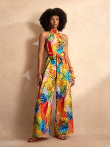 Slaydiva Combinaison pour femmes avec imprimé feuilles oranges colorées, col montant, bretelles halter, sans manches, jambes larges extra-longues, section de taille avec nœud papillon. Pour les vacances à la plage, nouveau printemps et été.