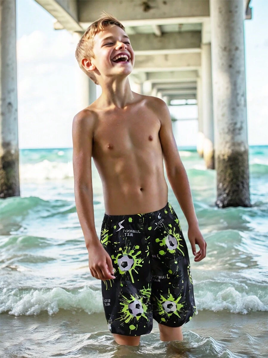 SHEIN Leap Crew Tween Boy Holiday Beach Glow-In-The-Dark Football Pattern Swim Trunks - Black - View 1