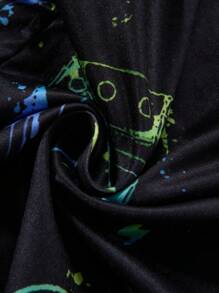 Pigiama da ragazzo pre-adolescente, con pantaloncini e maglia a maniche corte con stampa di controller di gioco grafico