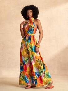 Slaydiva Combinaison pour femmes avec imprimé feuilles oranges colorées, col montant, bretelles halter, sans manches, jambes larges extra-longues, section de taille avec nœud papillon. Pour les vacances à la plage, nouveau printemps et été.