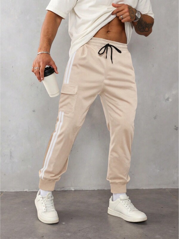 Manfinity Sporsity Męskie spodnie dresowe w paski z boczną kieszenią i ściągaczem w pasie, dla męża, prezent dla chłopaka, kremowe spodnie dresowe męskie