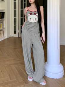 DAZY Conjunto de top holgado sin mangas y pantalón de pijama de pierna recta con estampado de dibujos animados y ribete de contraste