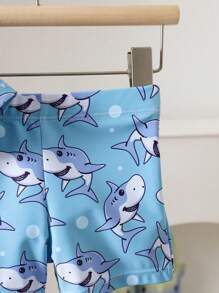 Toddler Boys' 1-3 Years Old Fashion Swimwear Set. Shark Print Sports Outfit. White Top With Light Blue Sleeves And Blue Shark Printed Shorts Set, Bright Colors, Suitable For Baby Boy's First Beach Trip And Swimming, Stretchy Fabric For Easy Movement, Perfect For Toddlers, Fashionable And Adorable Beach Look Boy Clothes For Kids Baby Boys Sets Baby Boy Beach Wear Toddler Beach Wear Boy Clothes For Baby Baby Boys Clothing Summer