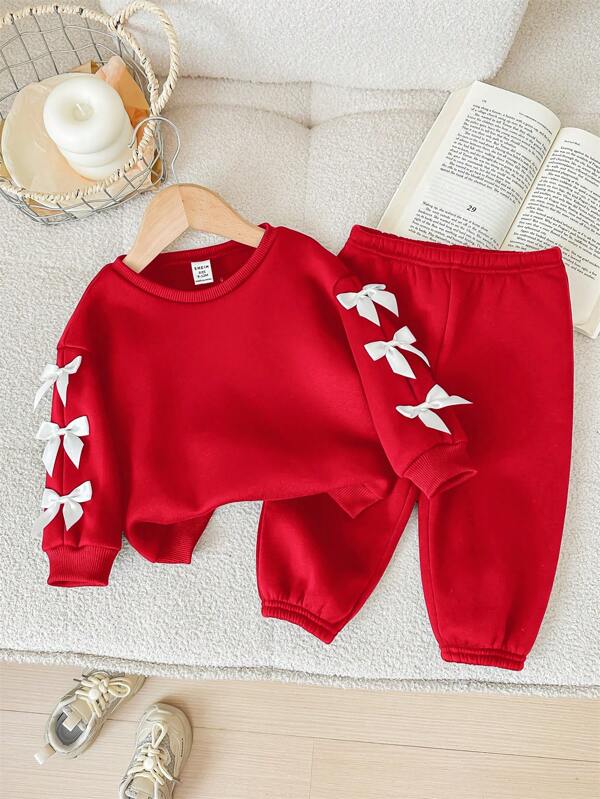 SHEIN Conjunto de 2 piezas para bebé niña: sudadera de manga larga con decoración de moño rojo y pantalón largo de cintura elástica, para otoño/invierno