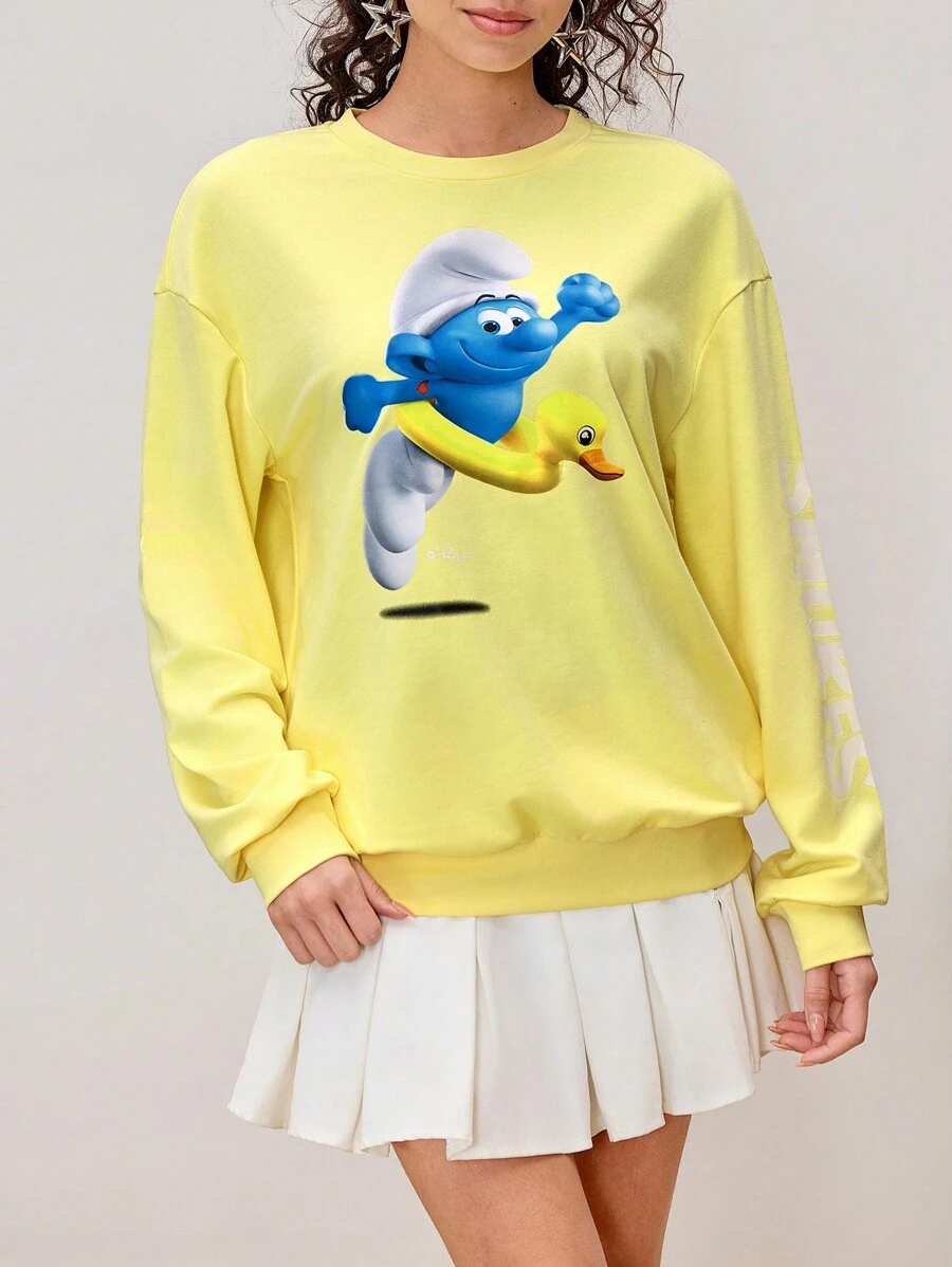 SHEIN X The Smurfs Felpa da donna casual con grafica a fumetti, scollo tondo e spalle scoperte - Giallo - Visualizzare 1