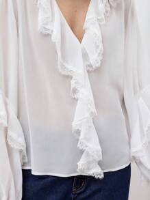 Maija Blusa de manga abullonada con cuello en V y ribete de volantes, camisa holgada y versátil de manga larga con botones delanteros y detalles de volantes en estilo bohemio para principios de primavera, en un look urbano y elegante