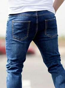 Manfinity Homme Jeans de mezclilla casuales con bolsillo y rotos simples talla grande para hombres