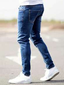 Manfinity Homme Jeans de mezclilla casuales con bolsillo y rotos simples talla grande para hombres