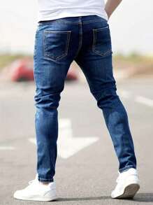 Manfinity Homme Jeans de mezclilla casuales con bolsillo y rotos simples talla grande para hombres