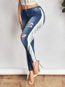 SHEIN SXY Jeans de talle bajo rasgados para mujer, nueva moda de verano con flecos laterales, pantalones vaqueros elásticos sexy y ajustados. - Azul - Ver 1