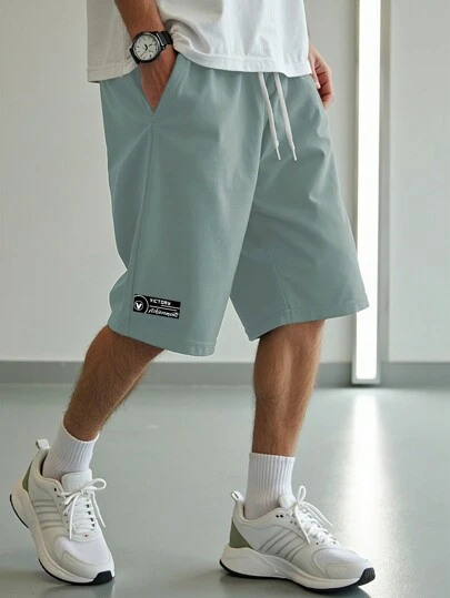 Manfinity Homme Shorts casuales holgados con cordón y bolsillo talla grande para hombre