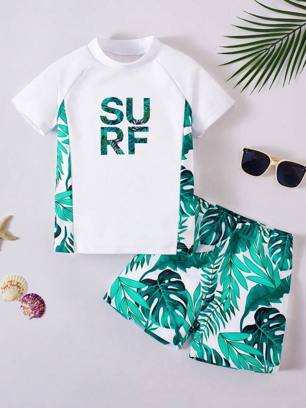 SHEIN 2pcs Young Boy Casual Holiday Botanical Print Round Neck Short Sleeve Top And Shorts Set, For Beach, Swimming, Surfing, Spring/Summer