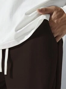 Manfinity Hypemode Pantalon de survêtement ample pour hommes avec cordon de serrage à la taille et poches en biais