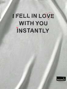 Manfinity Hypemode "Men's Casual Daily Style, Spring Vacation Look, INS Matching Item: Unique Niche Suede Fabric Short-Sleeve T-Shirt In Light Gray-Green With A 3D Foam Printed Design On The Front, Featuring A Heart And The Valentine's Day Slogan 'I FEEL IN LOVE WITH YOU INSTANTLY.' This T-Shirt Is Perfect For Spring And Summer Outfits And Ideal For Matching Couple Styles, Making It A Great Gift For Boyfriends Or Husbands."