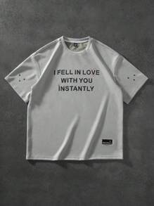 Manfinity Hypemode "Men's Casual Daily Style, Spring Vacation Look, INS Matching Item: Unique Niche Suede Fabric Short-Sleeve T-Shirt In Light Gray-Green With A 3D Foam Printed Design On The Front, Featuring A Heart And The Valentine's Day Slogan 'I FEEL IN LOVE WITH YOU INSTANTLY.' This T-Shirt Is Perfect For Spring And Summer Outfits And Ideal For Matching Couple Styles, Making It A Great Gift For Boyfriends Or Husbands."