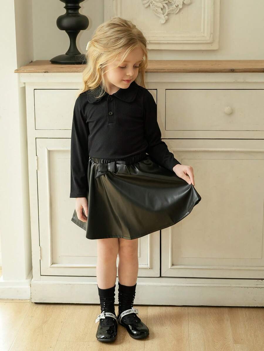 SHEIN Young Girl Ribbed Collar Long Sleeve Top And PU Leather Bowknot Skirt 2 Pieces Set, Fashion & Unique Outfit - Black - View 1