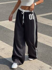 Pantalones de tiro bajo con contraste blanco y negro y estampado de letras