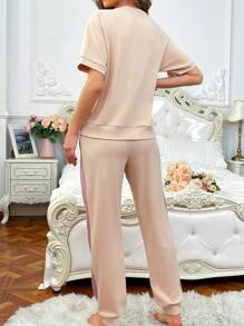 Conjuntos de pijama de mujer de manga corta con lazo, bordado de corazón y color contrastante de corte holgado