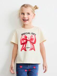 SHEIN Young Girls' Oversized Crew Neck Bow & Heart Print Pullover T-Shirt, Loose Fit, For Valentine's Day, Spring - Beige - View 1