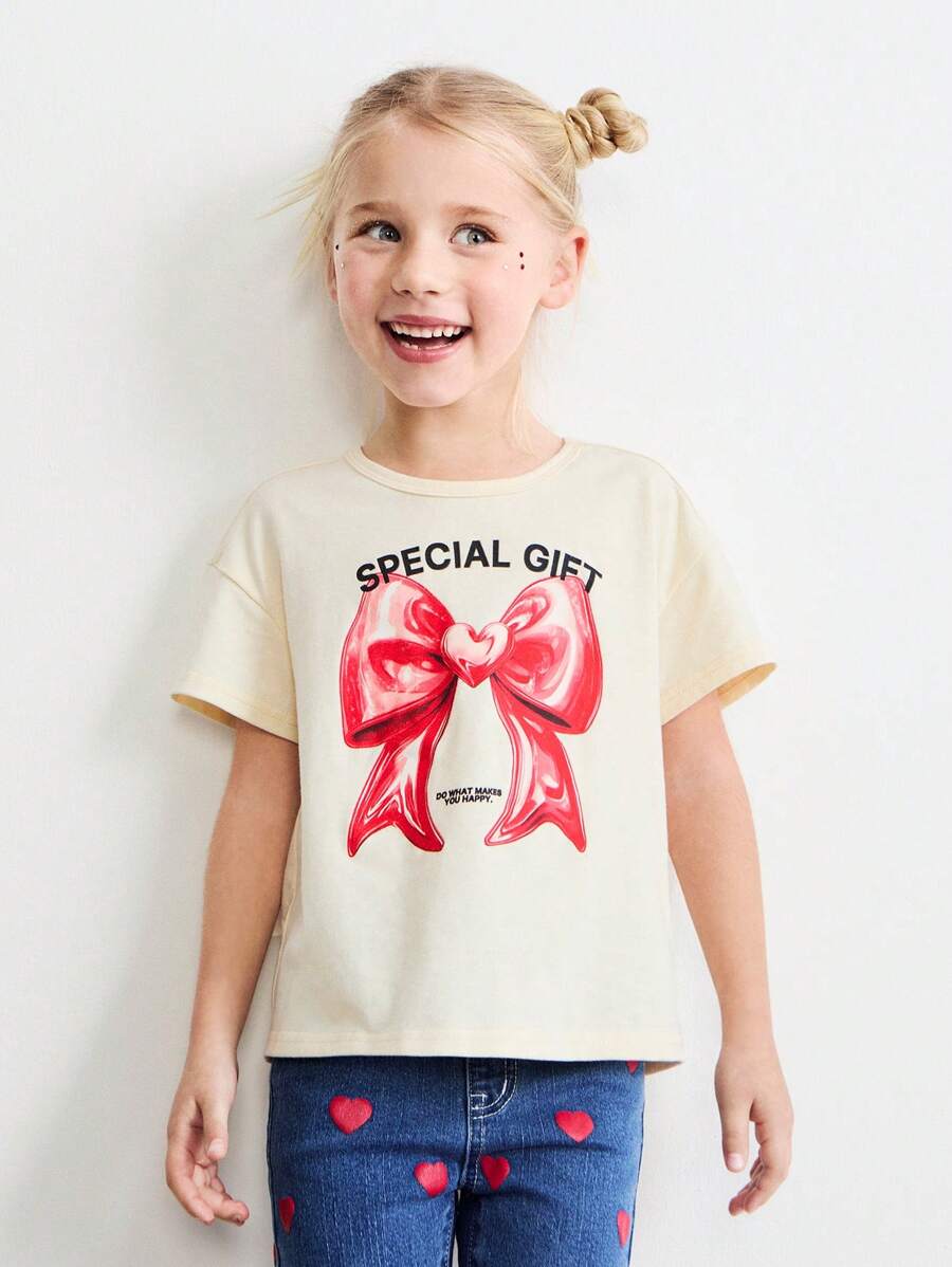 SHEIN Young Girls' Oversized Crew Neck Bow & Heart Print Pullover T-Shirt, Loose Fit, For Valentine's Day, Spring - Beige - View 1