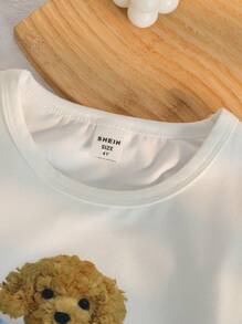 SHEIN Genkimix Kids 2 件套女孩卡通小狗与蝴蝶结印花针织长袖上衣和长裤睡衣套装