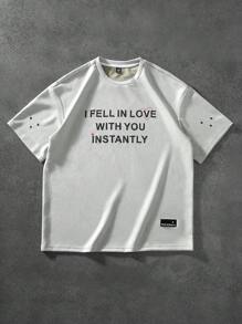 Manfinity Hypemode "Men's Casual Daily Style, Spring Vacation Look, INS Matching Item: Unique Niche Suede Fabric Short-Sleeve T-Shirt In Light Gray-Green With A 3D Foam Printed Design On The Front, Featuring A Heart And The Valentine's Day Slogan 'I FEEL IN LOVE WITH YOU INSTANTLY.' This T-Shirt Is Perfect For Spring And Summer Outfits And Ideal For Matching Couple Styles, Making It A Great Gift For Boyfriends Or Husbands."