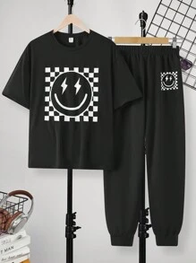 SHEIN 2 piezas Conjuntos casuales para adolescentes de camiseta de ajuste holgado con estampado de sonrisa sencilla y pantalones cortos; Ropa de primavera; Ropa para adolescentes varones; Chaquetas para adolescentes varones, vuelta al cole en primavera