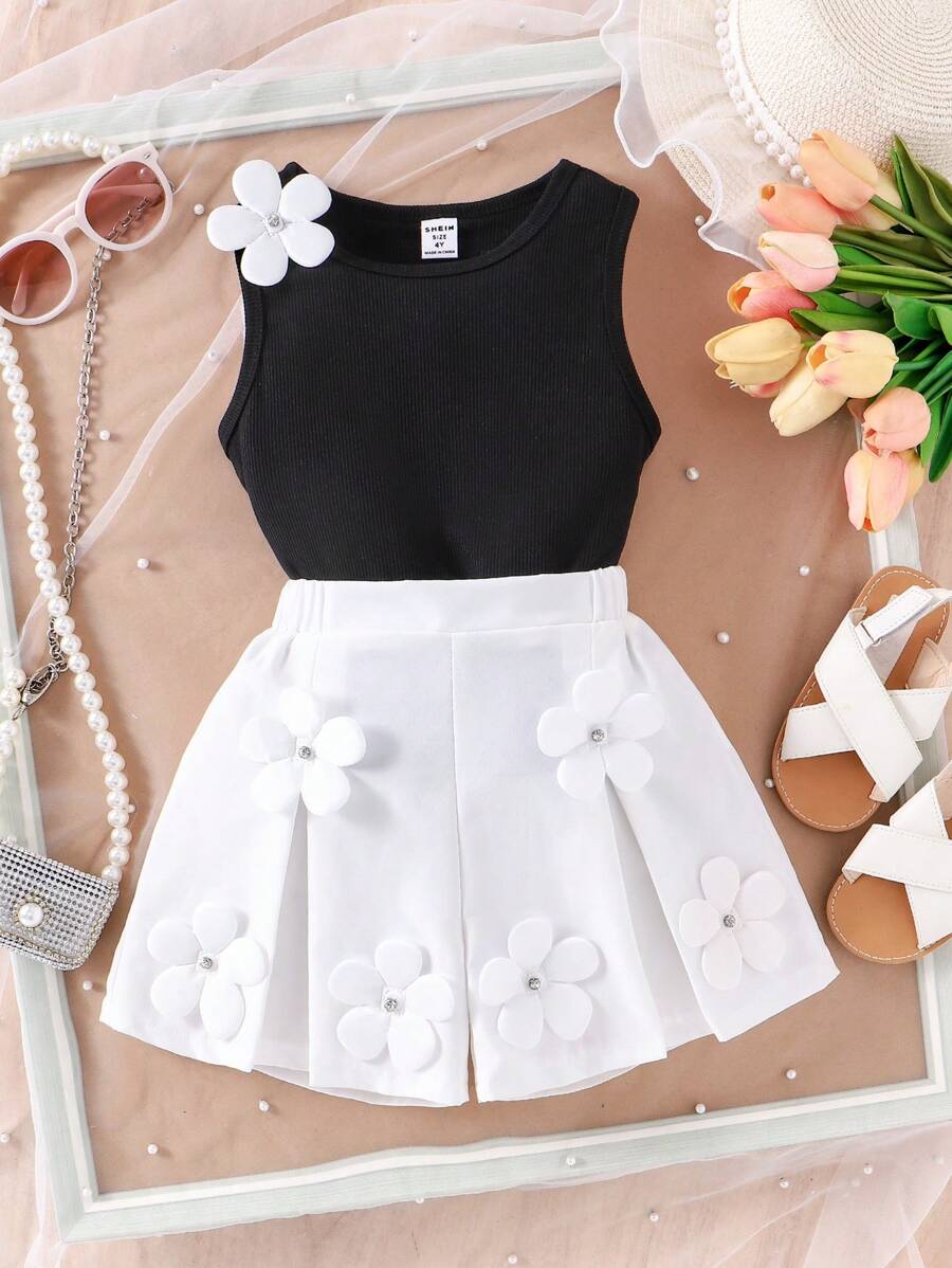 2 件套年轻女孩针织无袖 V 领白色五瓣花上衣和荷叶边短裤套装，时尚优雅的夏季服装 - 黑色 - 查看 1