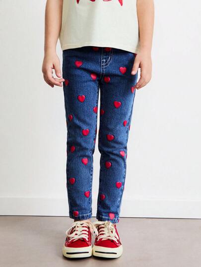 SHEIN Jeans azules de ajuste ceñido con estampado de corazón rojo para niñas jóvenes