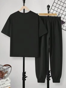 SHEIN 2 piezas Conjuntos casuales para adolescentes de camiseta de ajuste holgado con estampado de sonrisa sencilla y pantalones cortos; Ropa de primavera; Ropa para adolescentes varones; Chaquetas para adolescentes varones, vuelta al cole en primavera