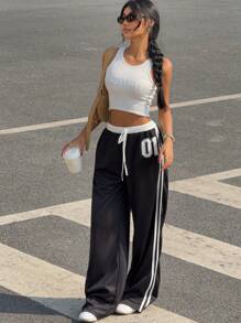 Pantalones de tiro bajo con contraste blanco y negro y estampado de letras