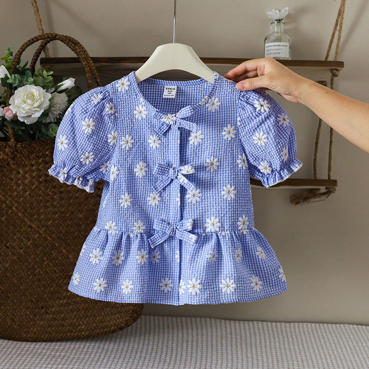Blusa de manga abullonada con lazo, estampado de margaritas y jacquard a cuadros para niñas