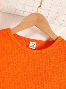 Sparklyn Bộ 2 chiếc áo crop top cổ chữ V tay lửng họa tiết dệt kim màu cam sáng và quần ống đứng họa tiết hoa nhỏ nhắn có cạp chun cho bé gái tuổi teen, trang phục thường ngày ngày lễ mùa hè - trái cam - Xem 5