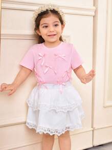 SHEIN Conjunto de blusa de punto de unicolor con decoración de moño y falda acampanada con volantes de encaje para niñas bebé, look casual y dulce para primavera/verano
