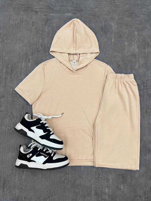 SHEIN Explorewe Set de 2 piezas para adolescentes varones: Camiseta con capucha de manga corta con bolsillos grandes en unicolor, combinada con shorts deportivos de unicolor. Mostrando la energía juvenil y el estilo de moda de los adolescentes.
