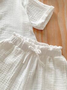 Set de 2 piezas de camisa informal tejida lisa y shorts para niña joven