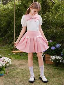 Wildeya Tween-Mädchen 2-teiliges Set, weiße Bluse mit Rüschen, Puffärmeln, Schleifenkragen und rosa Minirock mit Falten, Frühling/Sommer
