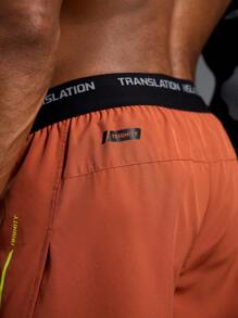 Manfinity Sport Polished Shorts esportivos com fenda lateral e cós em bloco de cores masculino
