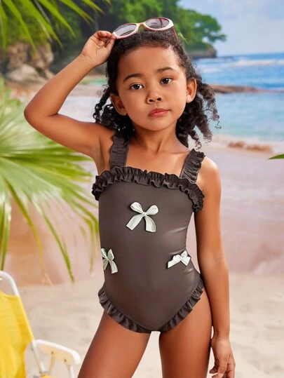 1pc Young Girl Plain Monokini Swimsuit, White Textured Bowknot Frill Trim Shoulder Strap, Ruffled Edge Bottoms