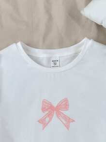 SHEIN Teen Girls' Sweet Cute Pink Bow Print White Casual Short Sleeve T-Shirt